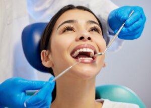 How Dental Cleanings and Exams Remove Buildup
